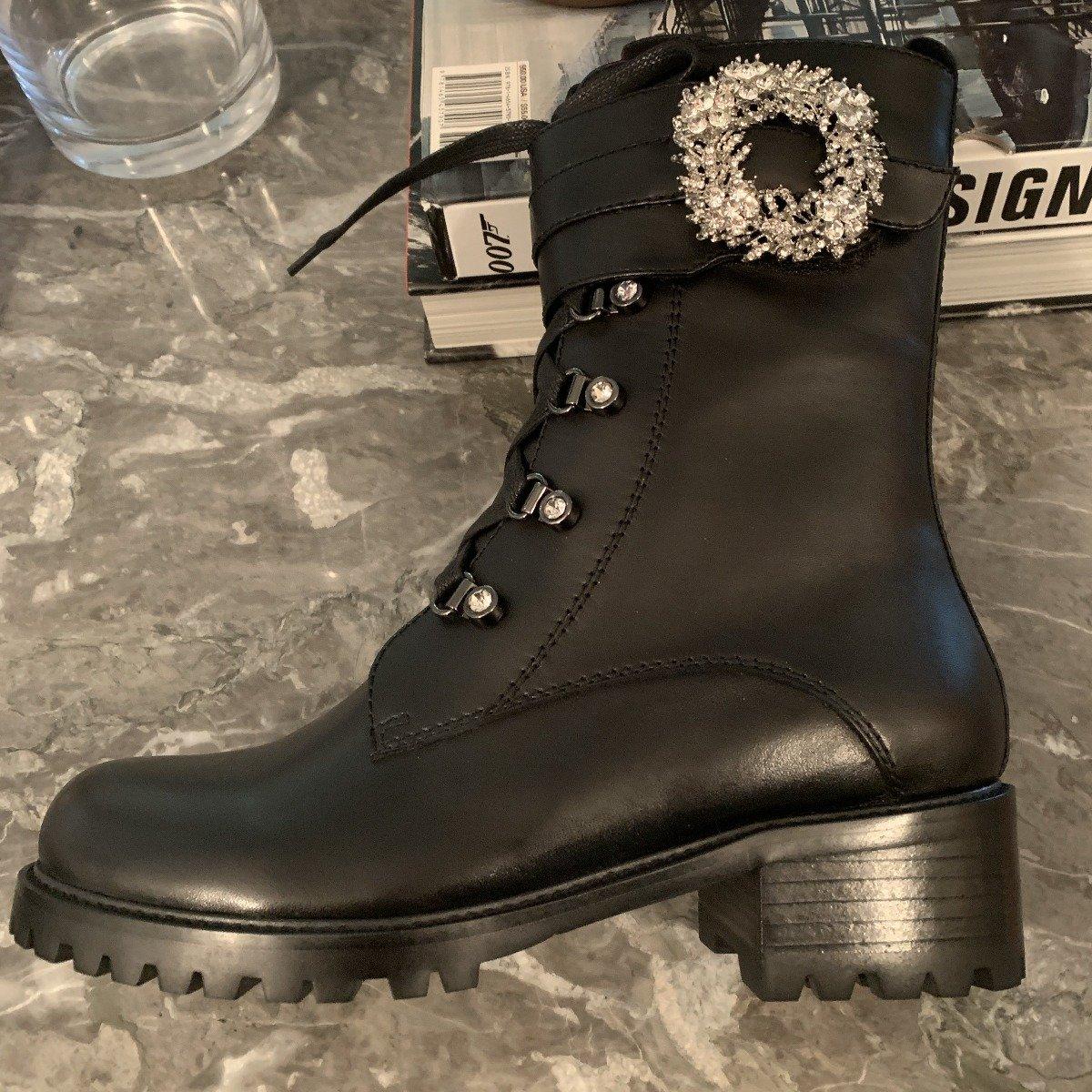 Black combat boots with lace-up design