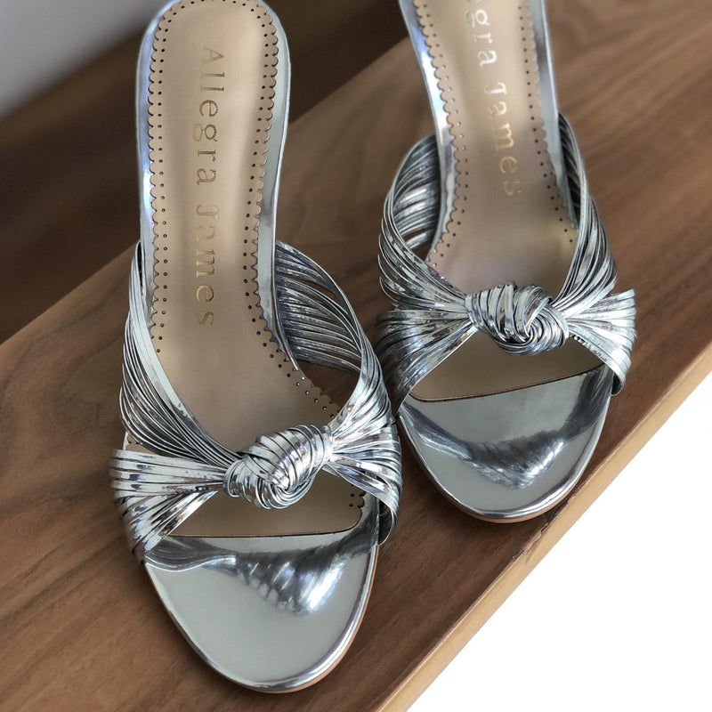 Silver sandals with slip-on style and knot design upper  