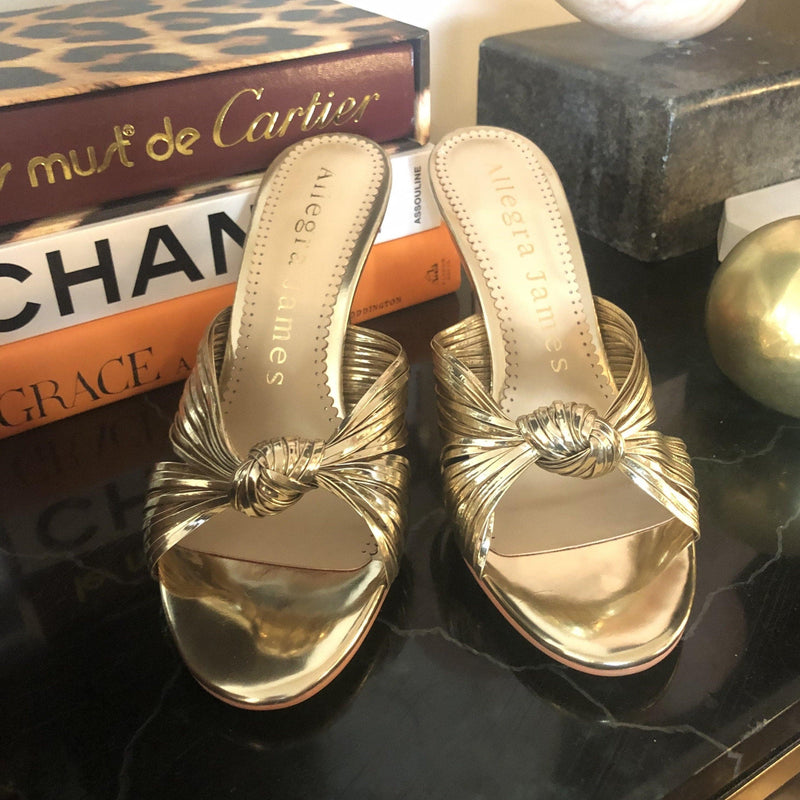 Golden sandals with slip-on style and knot design upper  
