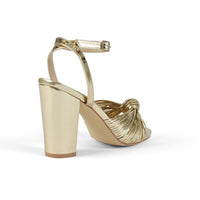Gold chunky heels with ankle buckle closure - back view 