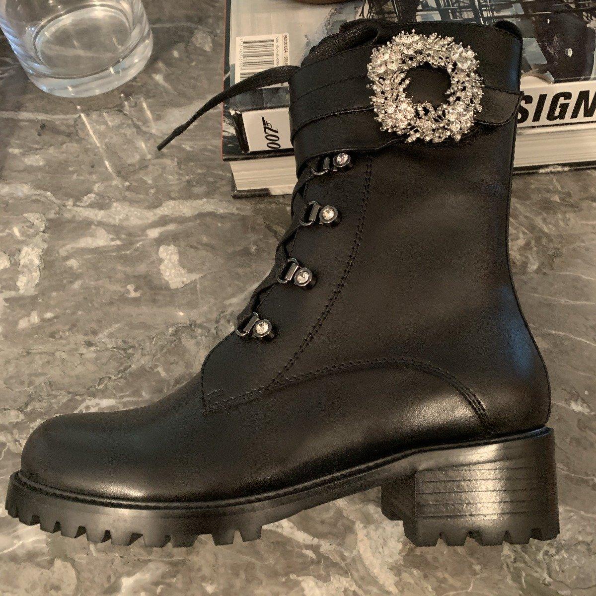 Black combat boots with lace-up design  